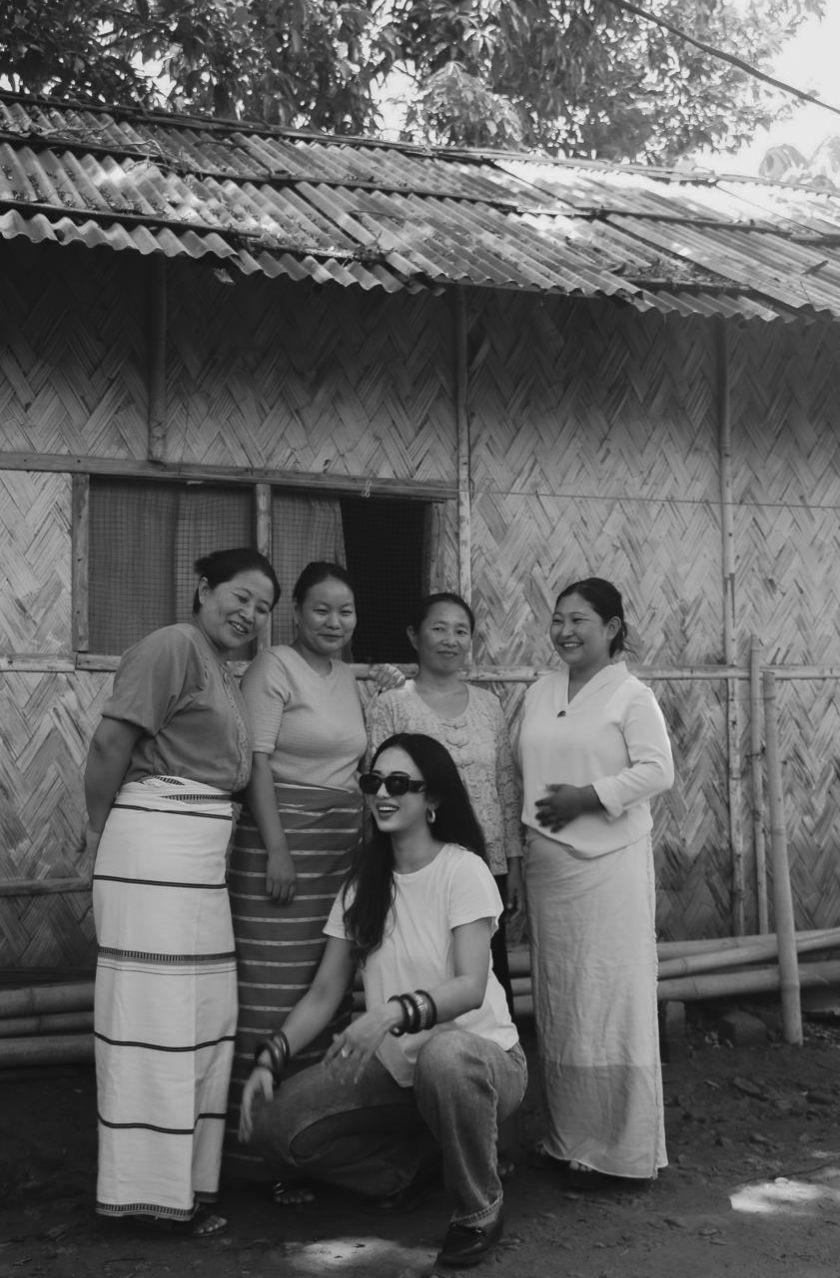 Otsü Clothing Co. founder Asenla Jamir with Naga artisans whose works she documented, combining research, storytelling, and craftsmanship in her creative process. Behind every Otsü collection is extensive documentation and collaboration with Naga artisans, whose knowledge and craftsmanship inspire the brand's contemporary designs.